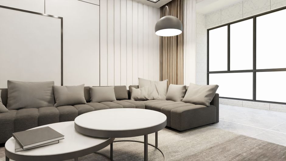 Elegant modern living room with minimalist decor and ample natural light.
